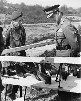 Duke of Edinburgh inspecting paratroopers weapons