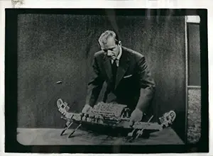 Describe: Duke of Edinburgh with model boat on TV programme