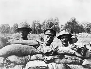 Deceive: Dummy heads rising above the side of a trench, WW1