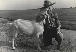 Jamboree: Dutch boy scout at a jamboree with a goat