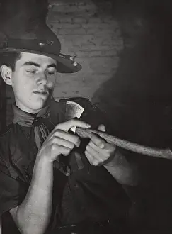 Sharpening: Dutch rover scout sharpening an axe