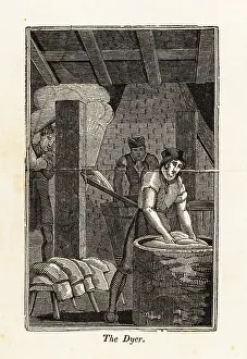 Dyer: Dyer dunking bolts of fabric in a vat in a workshop