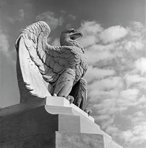 Talons: Eagle Statue Against Sky Clouds