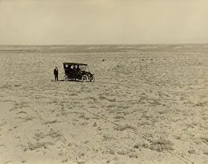 Wasteland: Early automobile parked in an expansive area