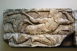 Frieze: Early Classical. Satyr wielding a tree branch. 5th BC. Lyci