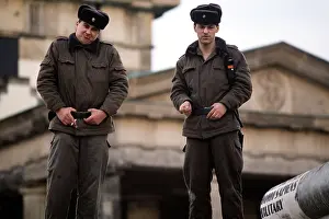 Glasnost: East German guards at ease atop the Berlin ?