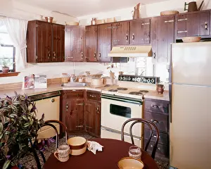 Dishwasher: Eat-In Kitchen with Dark Wooden Dated Cabinets