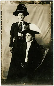 Two Edwardian men dressed as suffragettes
