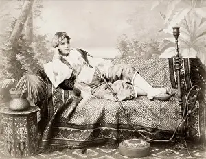 Longue: Egypt or Turkey woman with a hookah pipe