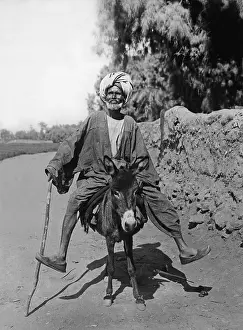 Bizzare: Egyptian riding a donkey, 1937
