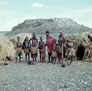 Cairns: El Molo tribe standing in front of the domed huts