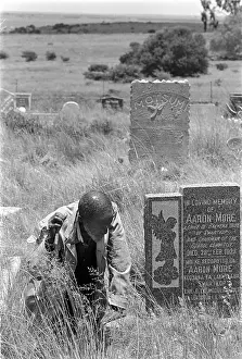 Removals: An elder visits the grave of an ancestor in Mogopa