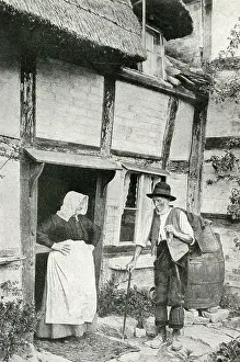 Timbered: Elderly couple outside cottage, Little Comberton, Worcs