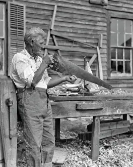 Crosscut: Elderly Craftsman Checking the Straight Line of