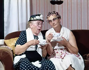 Curlers: two elderly ladies drinking tea, gossiping