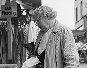 Piercing: Elderly lady and small pet dog