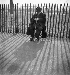 Fenced: Elderly man