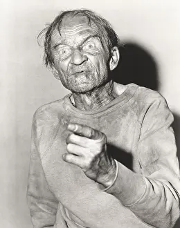 Wrinkled: Elderly man pointing a finger