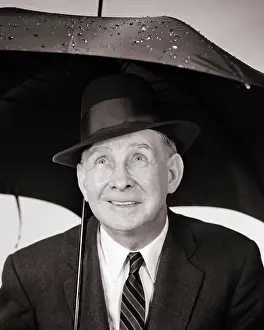 Precipitation: Elderly Man under Umbrella Looking up