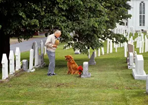 Cam001: Elderly Man Visiting Grave Site Standing by Headstone