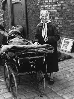 Ragged: Elderly rag lady with Silver Cross Pram