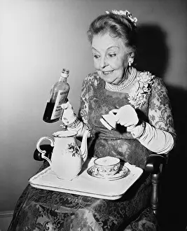 Teapots: Elderly woman spiking her tea