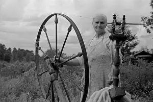 Ozarks: Elderly woman at her spinning wheel in the ?