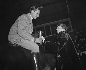 Raisers: Eleanor Roosevelt presents a trophy to actor Errol