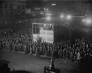 Public Event: Election returns are projected from a booth by the