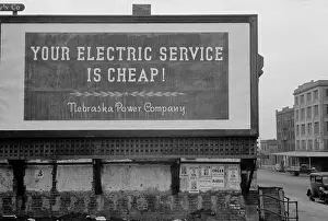 Midwest: Your Electric Service is Cheap reads a 1930s