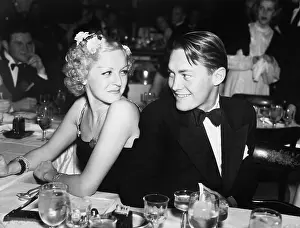 Freshness: Elegant couple sitting together and looking at each other