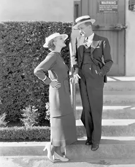 Infatuated: Elegant couple standing together and looking at each other