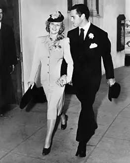 Infatuated: Elegant couple walking together hand in hand