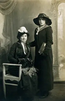 Muff: Two elegant ladies dressed for the outdoors