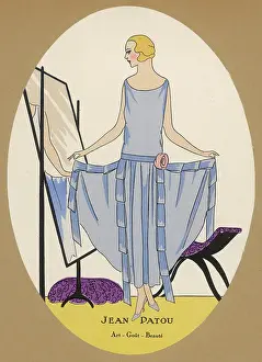 Admires: Elegant lady looking in the mirror