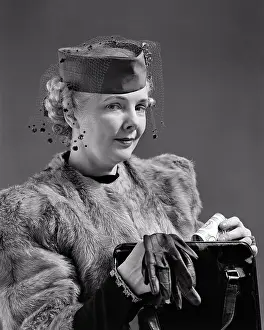 Oldsters: Elegantly Dressed Woman Looking at Camera Wearing