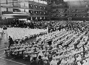 Gowned: Elijah Muhammad addressing an assembly of ?