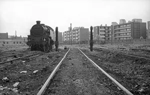 Elms: Nine Elms Loco Yard with steam engine and flats beyond