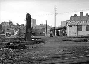 Barrow: Nine Elms Loco Yard with water column and man with barrow