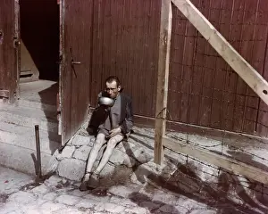 Emaciated: An emaciated survivor drinking from a metal bowl