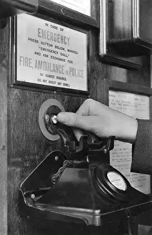 Emergency call button in telephone box