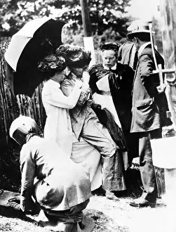 Forcible: Emmeline Pankhurst (1858-1928, left of center), ?