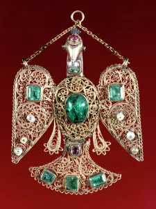Enamelled: An enamelled and gem set gold, eagle pendant