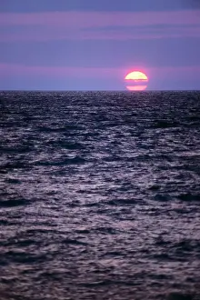 Lga001: End of Day Sunset over Calm Ocean Water