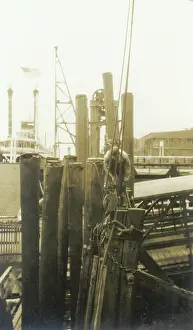 Sepia Images: Engineer installing dock pilings