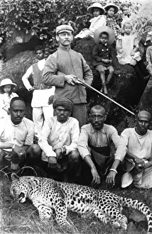 English Hunter posing with a dead leopard