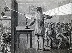 Darkened: Engraving depicting a solar spectrum being demonstrated