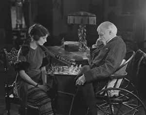 Grandparent: Engrossed in chess game