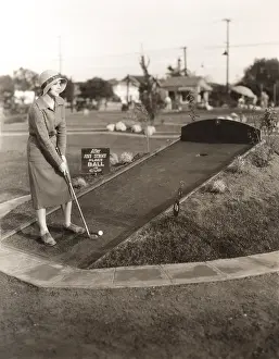 1910s 1940s: Enjoying a solo game of miniature golf