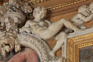 Ephebe: Ephebe in carved stucco from the frame of the